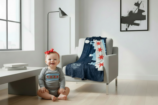 Baby girl with red bow wearing solid gray long sleeve Chicago flag onesie