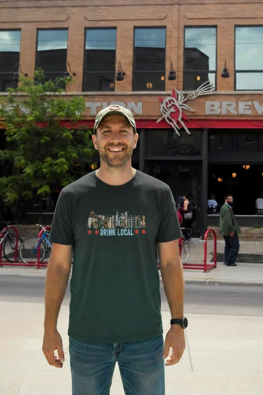Man in dark charcoal Drink Local shirt at brewery